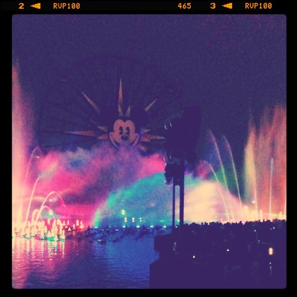 colorful bursts of water in front of Mickey ferris wheel