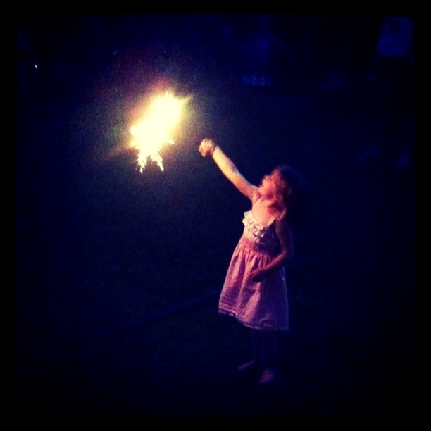 young girl holding a sparkler