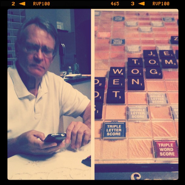 split photo of my dad looking at his phone and a Scrabble board