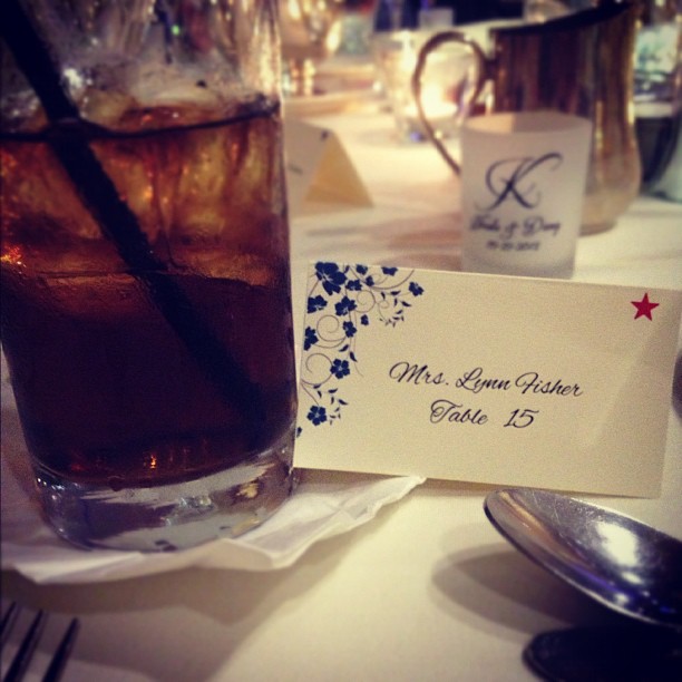 table place card that says “Mrs. Lynn Fisher, Table 15” 