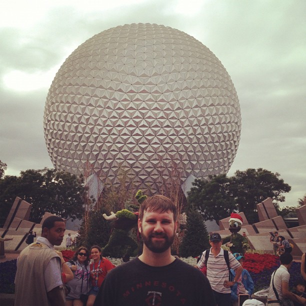 Clay standing in front of Spaceship Earth at Epcot