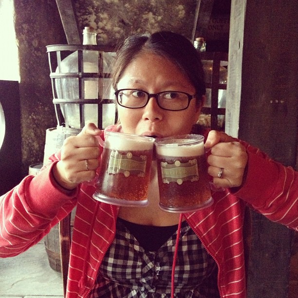 Lynn holding up two butterbeers to her mouth