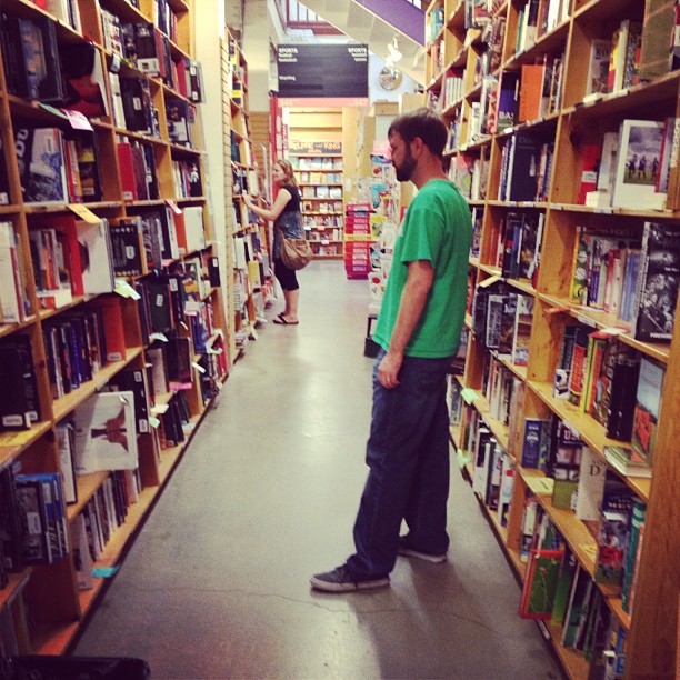 Clay looking at some books in Powell’s store