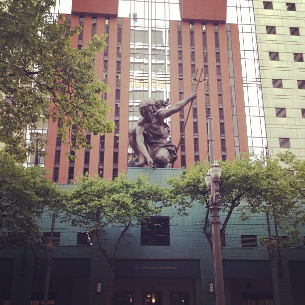 copper Portlandia, a classical woman holding a trident, statue atop a building