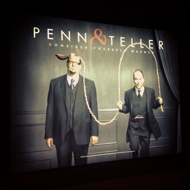 ad sign for Penn & Teller with Teller jumping rope with Penn’s brains