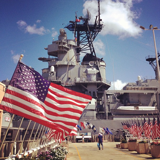 rows of American flags leading to the Battleship Missouri