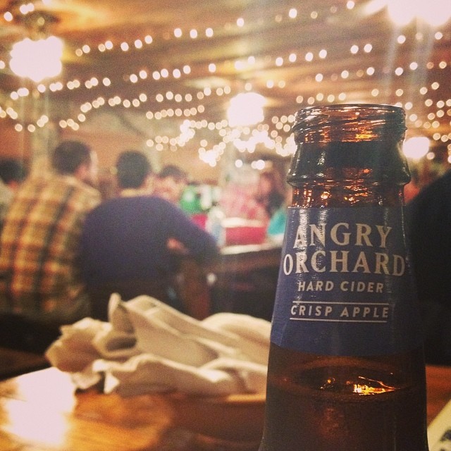 a bottle of Angry Orchard cider in a bbq restaurant