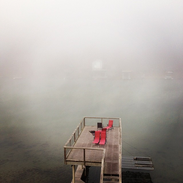 a dock sitting on a bed of fog