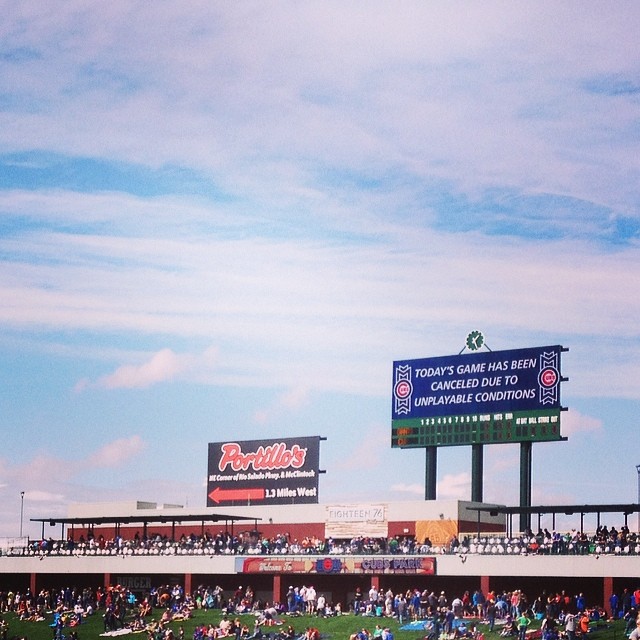 clear blue skies at Cubs spring training with sign that says “Today’s game has been canceled due to unplayable conditions”