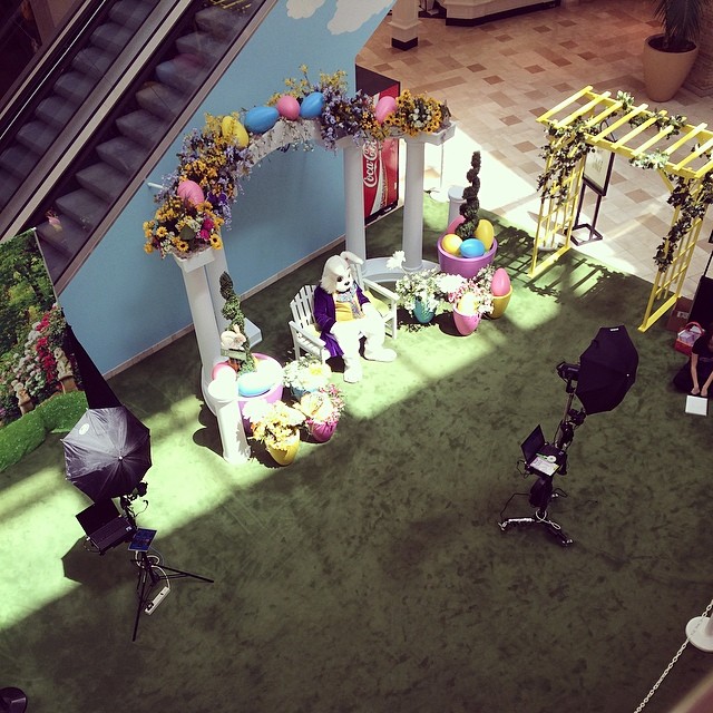 Easter Bunny sitting alone at the picture taking spot in the mall. He looks slumped and dejected.