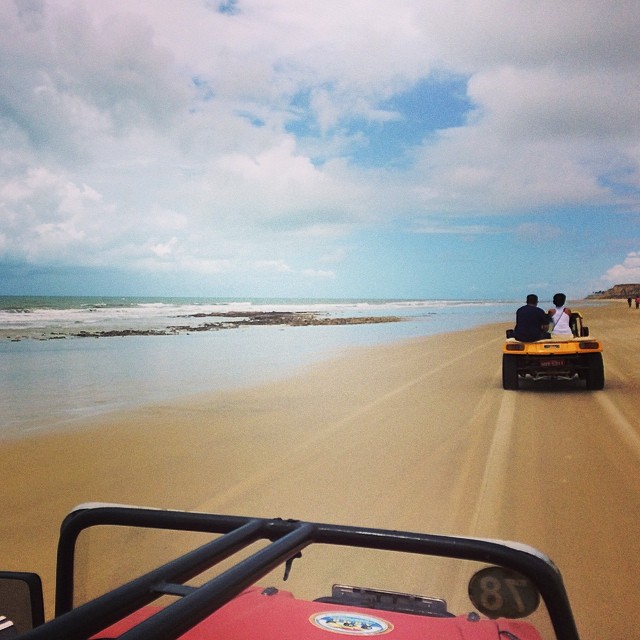 riding little buggies across the beach