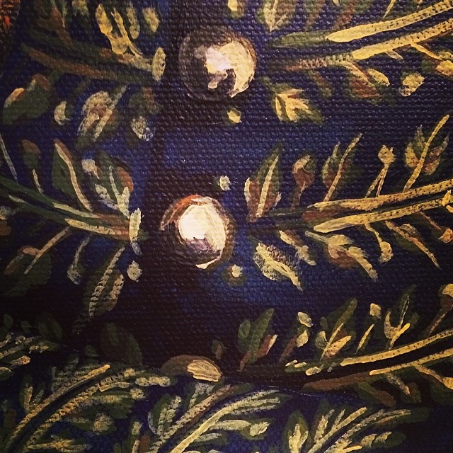 close up of a painting of fabric and gold buttons