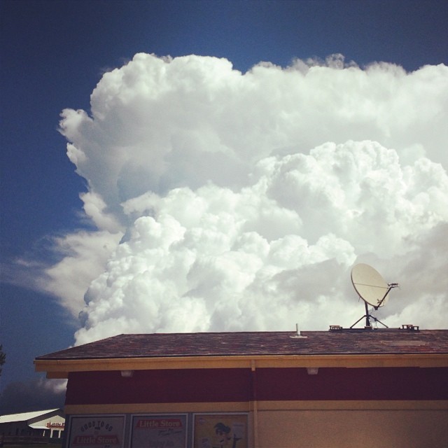 a square block of the fluffiest clouds ever against a deep blue sky