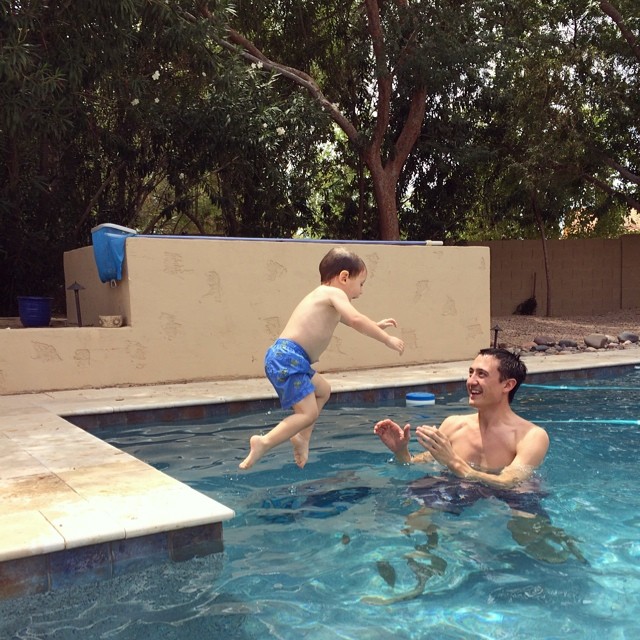 Henry jumping into the pool where Steve waits