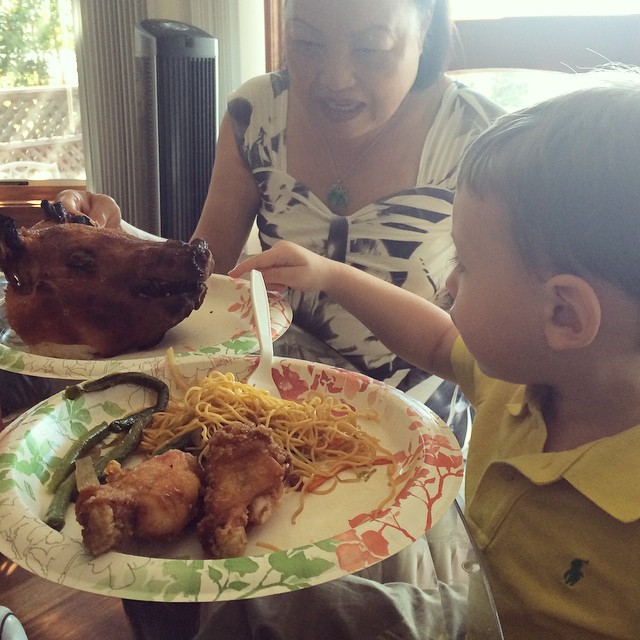 Henry pointing to the pig’s head on my mom’s plate