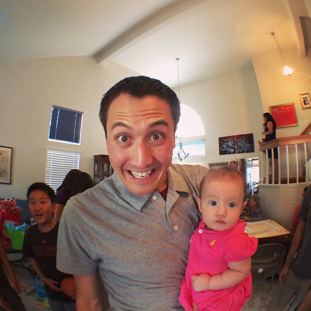 fish eye photo of Steve holding baby Rebekah