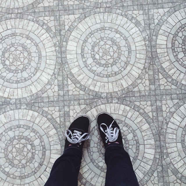 pair of Vans on some cool mosaic tile flooring