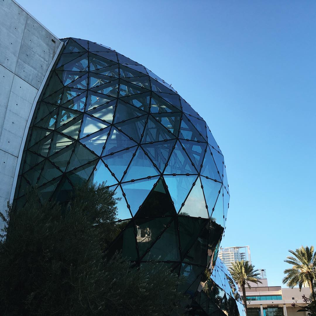 geodesic glass dome protuding from a concrete building