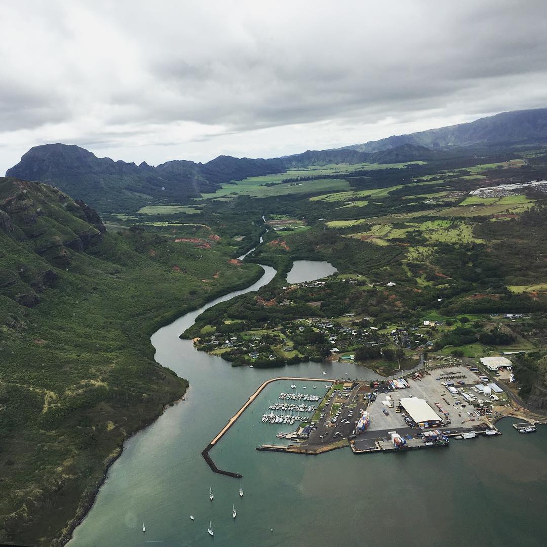 aerial view of a harbor and Hawaiian landscape