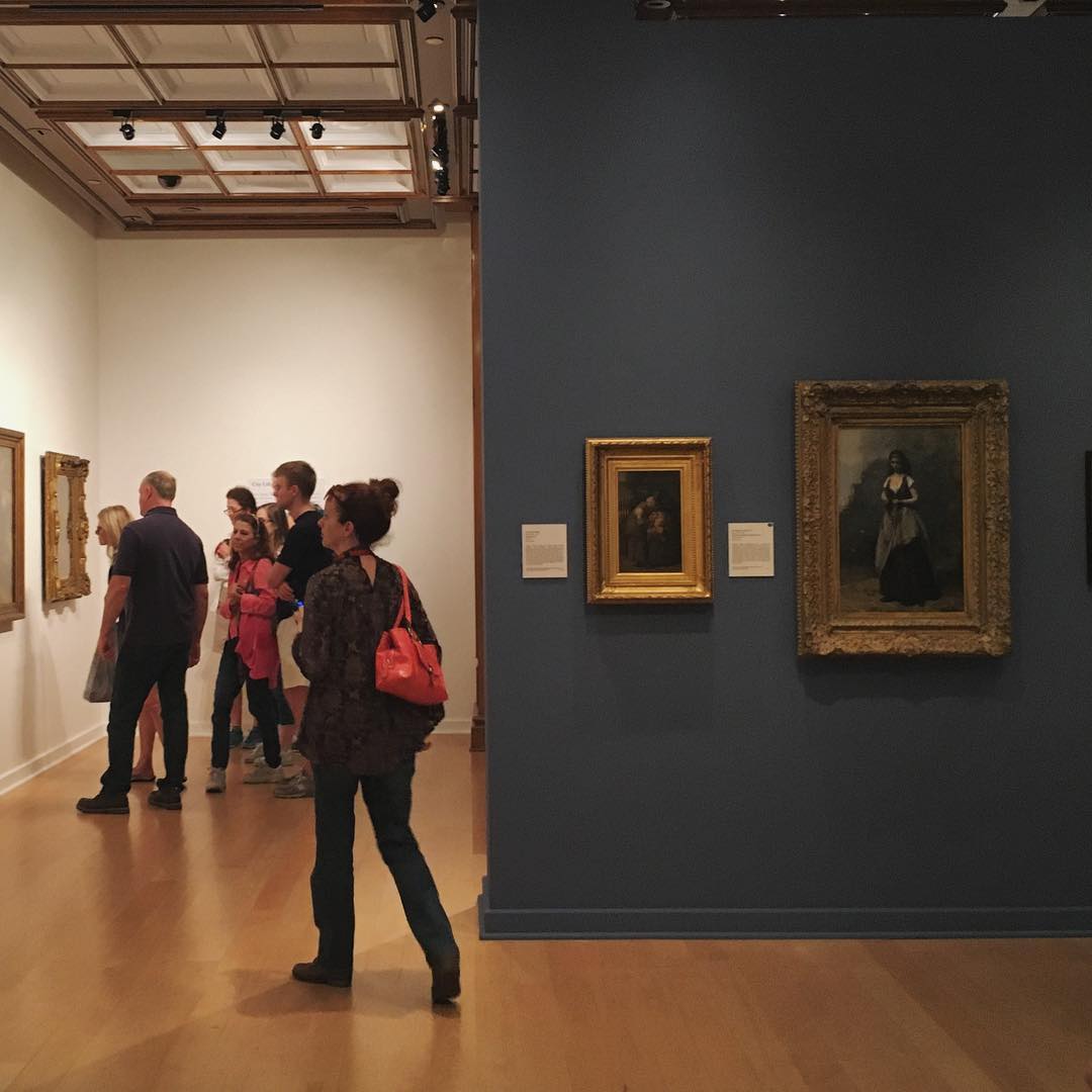 people viewing art in a gallery