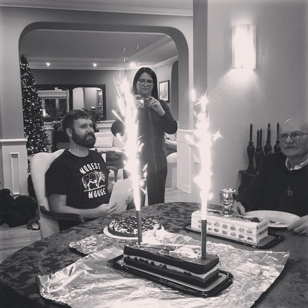 Clay with a birthday cake and the candles are like little flares