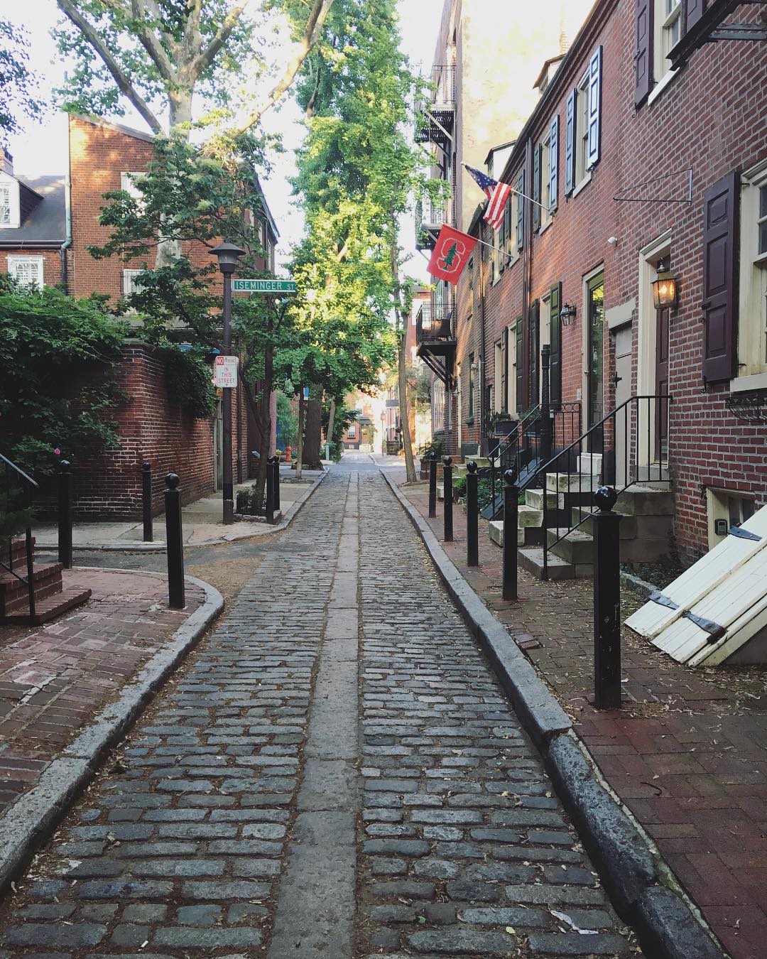 brick homes along a cobblestone street