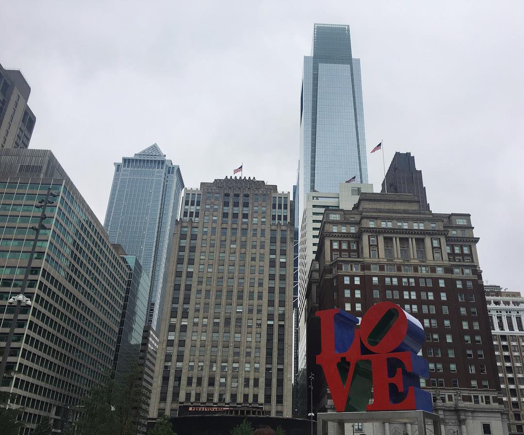 Robert Indiana LOVE sculpture with Philadelphia buildings behind