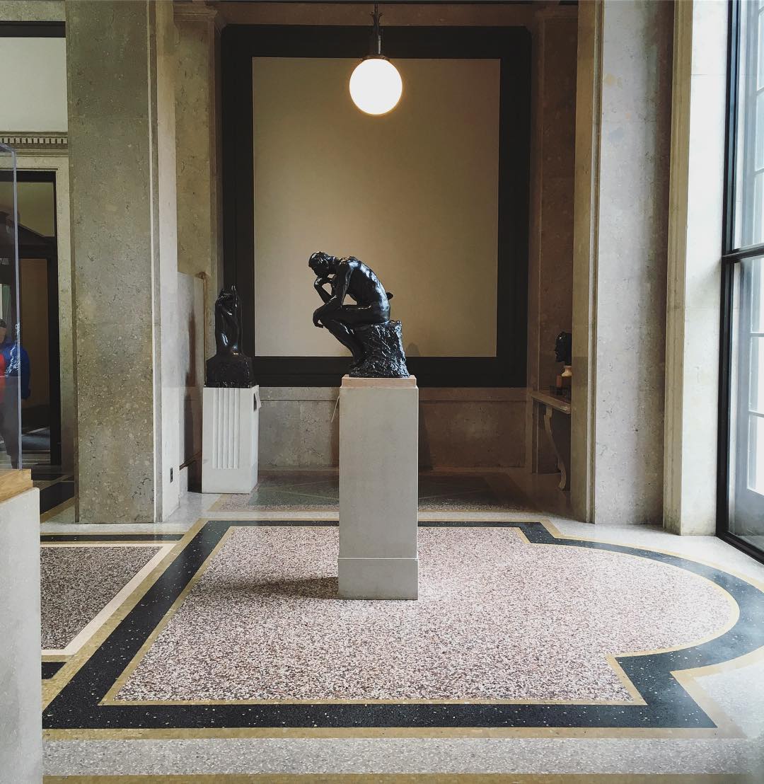 atrium of art museum with small version of Rodin’s The Thinker on a pedestal