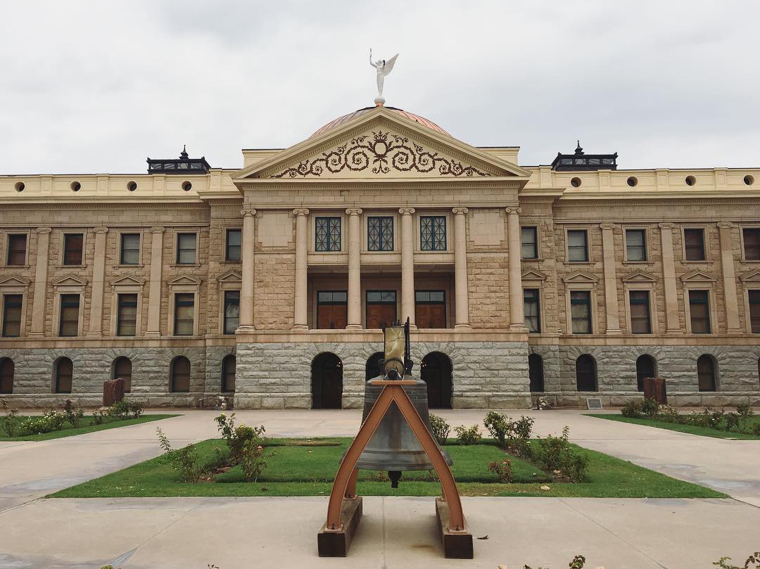 capitol building with giant bell out front