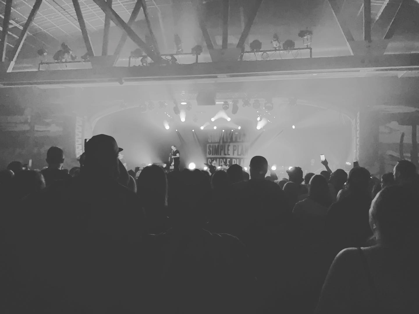 black and white shot of a crowd at a Simple Plan show